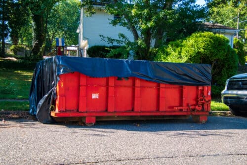 A 20-Yard Dumpster Rental sitting in front of a client’s house.