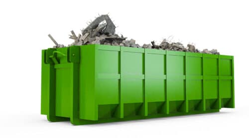 Green dumpster with debris
