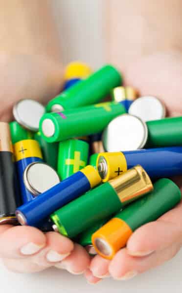 Hands Holding Batteries