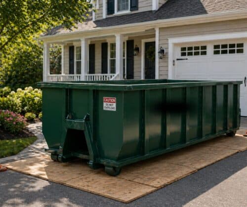 dumpster in front of house